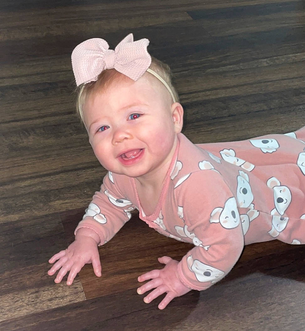 Braylee joined the competition — help win amazing prizes! baby, baby_toddler_clothing, cheek, eye, face, flash_photography, flooring, fun, grass, happy, head, headband, headgear, headpiece, pattern, person, pink, sleeve, smile, toddler