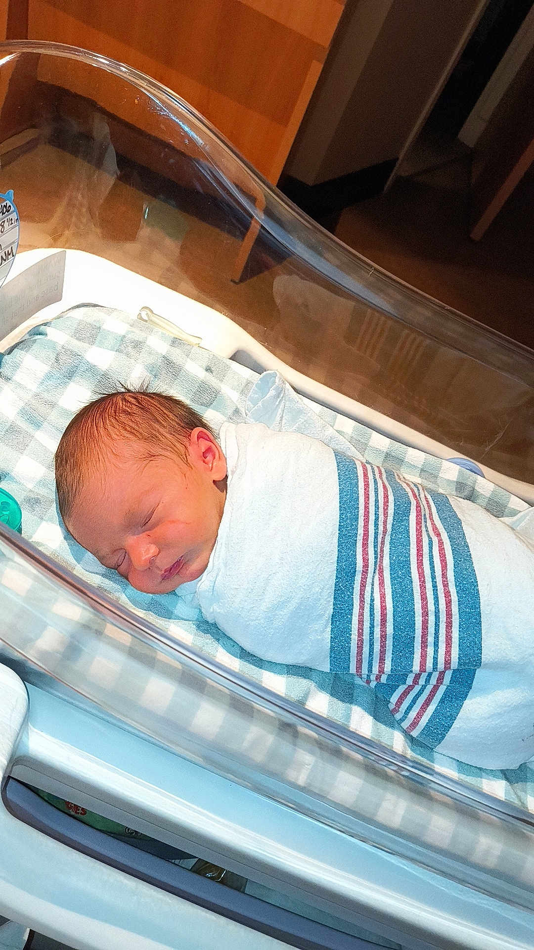 Marcus joined the competition — help win amazing prizes! newborn, baby, hospital, bassinet, blanket, sleeping, infant, swaddled, face, peaceful, indoor, healthcare, patient, wooden, bed, soft, skin, lying_down, quiet, resting