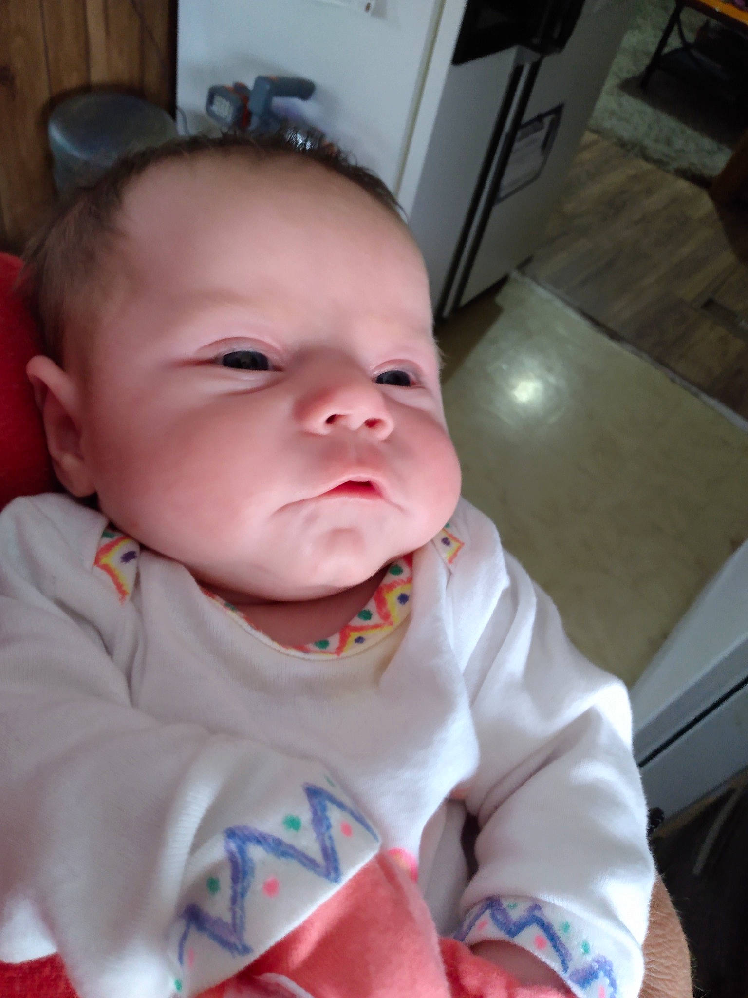 Aria is registered to the contest to win money with this photo: baby, baby_toddler_clothing, cheek, collar, comfort, ear, eye, eyebrow, face, fun, happy, head, iris, lip, mouth, neck, nose, person, skin, sleeve