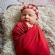 Charlie participe au concours pour gagner de l'argent avec cette photo : newborn, baby, sleeping, wrapped, blanket, headband, floral, flower_crown, cushion, furry, texture, boho, decor, peaceful, portrait, infant, soft, cozy, resting, indoors