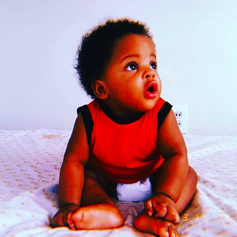 Olive is registered to the contest to win money with this photo: abdomen, baby, baby_toddler_clothing, barefoot, cheek, child, comfort, ear, finger, foot, human_body, joint, mouth, nose, person, sitting, skin, stomach, surprise, toddler