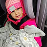 Lilith joined the competition — help win amazing prizes! toddler, child, car_seat, pink_hat, pom_pom, blanket, jacket, smile, face, winter_clothing, seatbelt, car_interior, cozy, warm, cute, portrait, indoors, happy, baby, snuggled