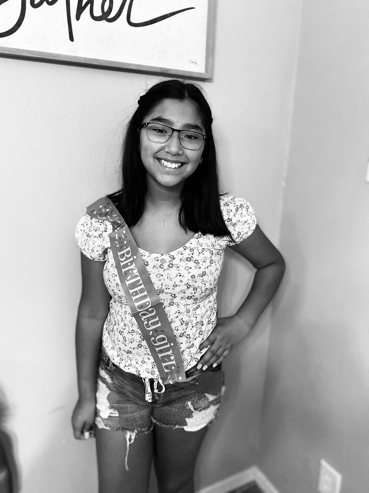 Janelle is registered to the contest to win money with this photo: black_and_white, eyewear, fashion, flash_photography, glasses, human, human_body, joint, joy, knee, leg, person, photograph, shoulder, sleeve, smile, standing, style, thigh, vision_care