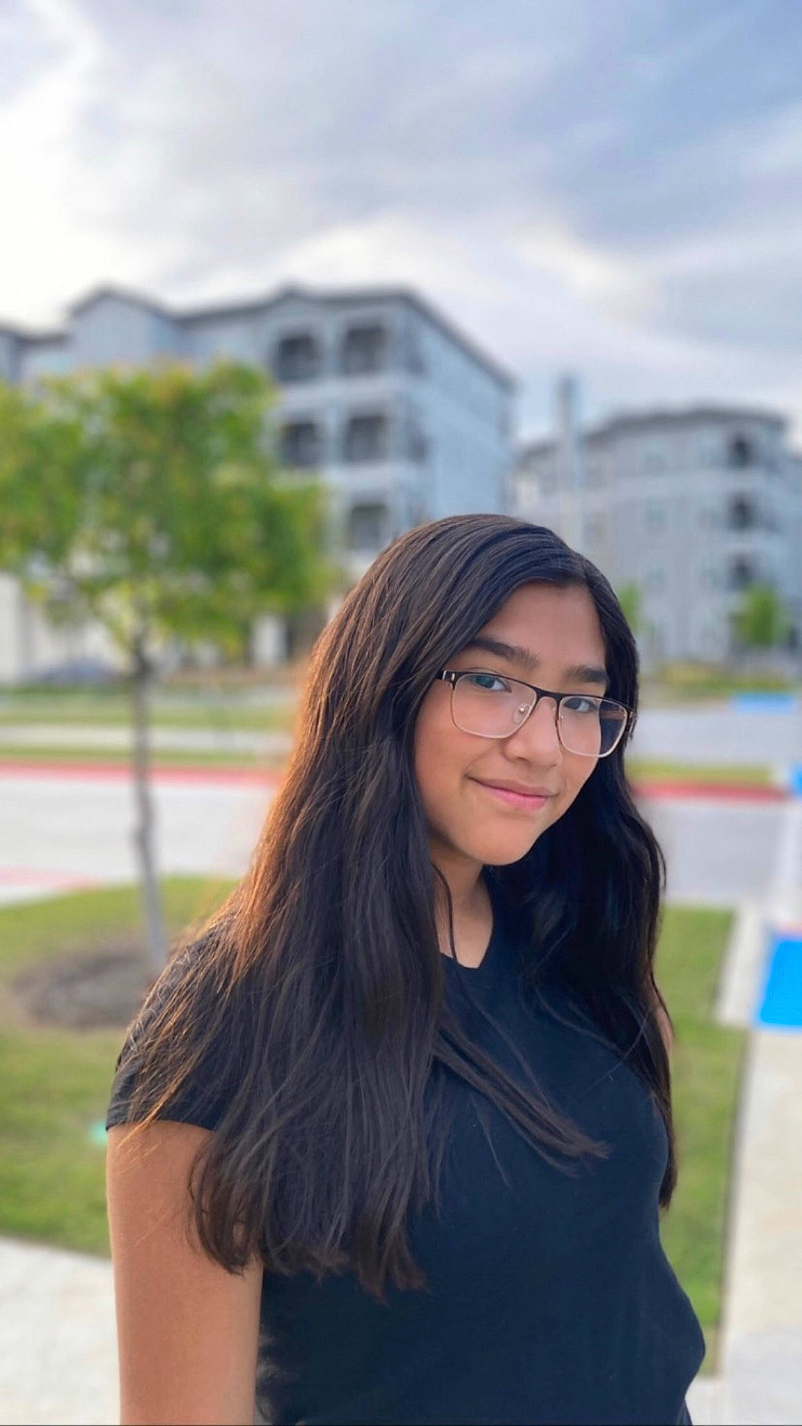 Janelle is registered to the contest to win money with this photo: black_hair, brown_hair, cloud, electric_blue, eyebrow, eyewear, flash_photography, formal_wear, fun, glasses, grass, happy, joy, layered_hair, leisure, lip, long_hair, person, sky, street_fashion