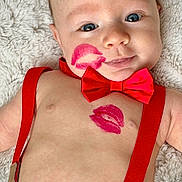 Levi is registered to the contest to win money with this photo: adorable, baby, baby_fashion, blue_eyes, child, closeup, cute, denim_pants, face, happy, infant, lipstick_kiss, lying_down, portrait, red_bow_tie, red_suspender, shirtless, skin, smile, soft_blanket