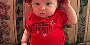 Elaina is registered to the contest to win money with this photo: accessories, baby, bowtie, clothing, couch, cushion, diaper, face, formalwear, furniture, hat, head, homedecor, person, photography, portrait, shorts, sitting, t_shirt, tie