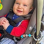 Landon is registered to the contest to win money with this photo: accessories, baby, bodypart, clothing, coat, face, finger, hand, happy, head, jacket, mouth, pants, person, photography, portrait, smile, stroller, transportation, vehicle