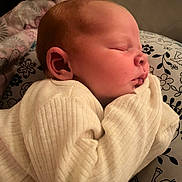 Willow is registered to the contest to win money with this photo: baby, sleeping, infant, closeup, face, cozy, sweater, pillow, pattern, bird, flower, soft, cute, child, peaceful, rest, indoors, newborn, skin