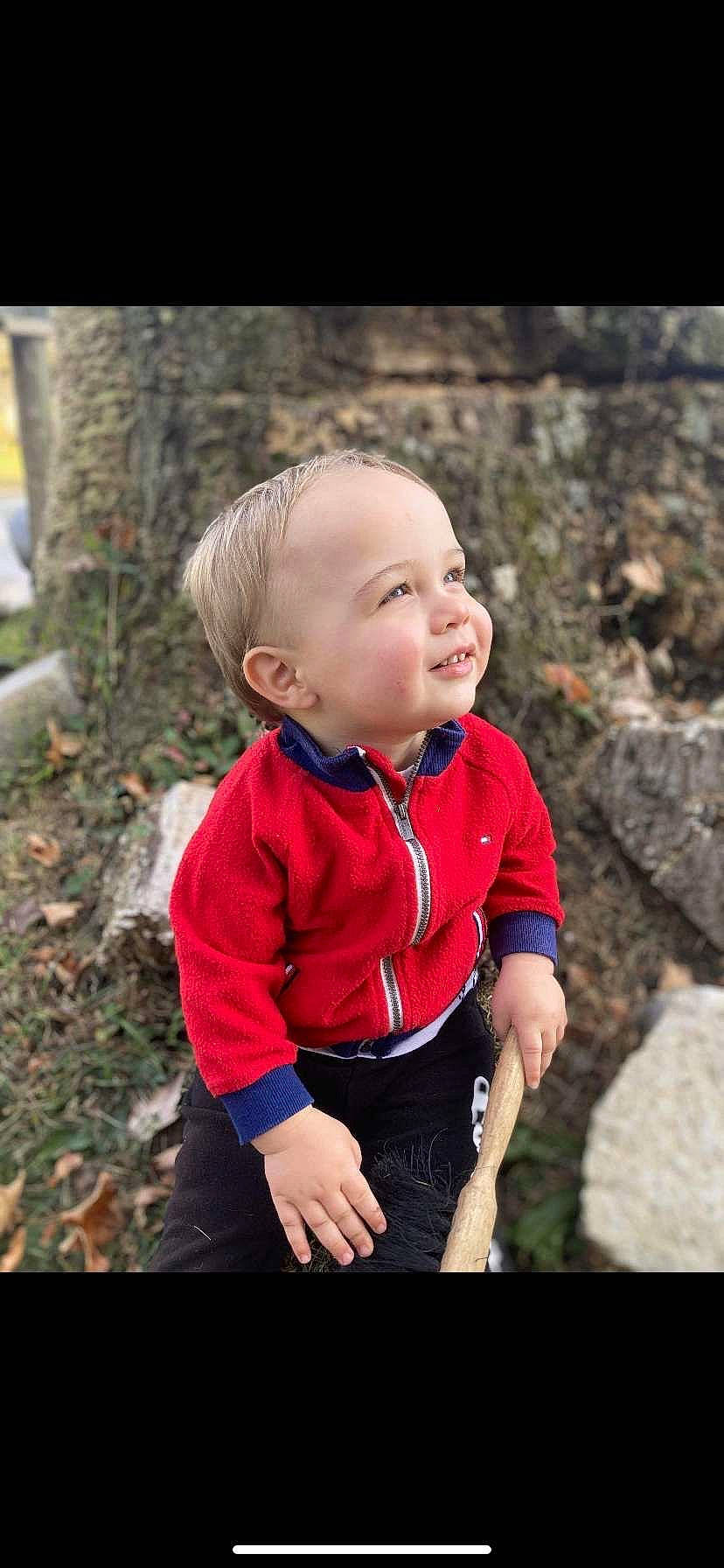 Levi is registered to the contest to win money with this photo: arm, baby, baby_toddler_clothing, dress, eye, flash_photography, grass, hair, happy, leisure, lip, people_in_nature, person, plant, sleeve, smile, standing, t_shirt, toddler, tree