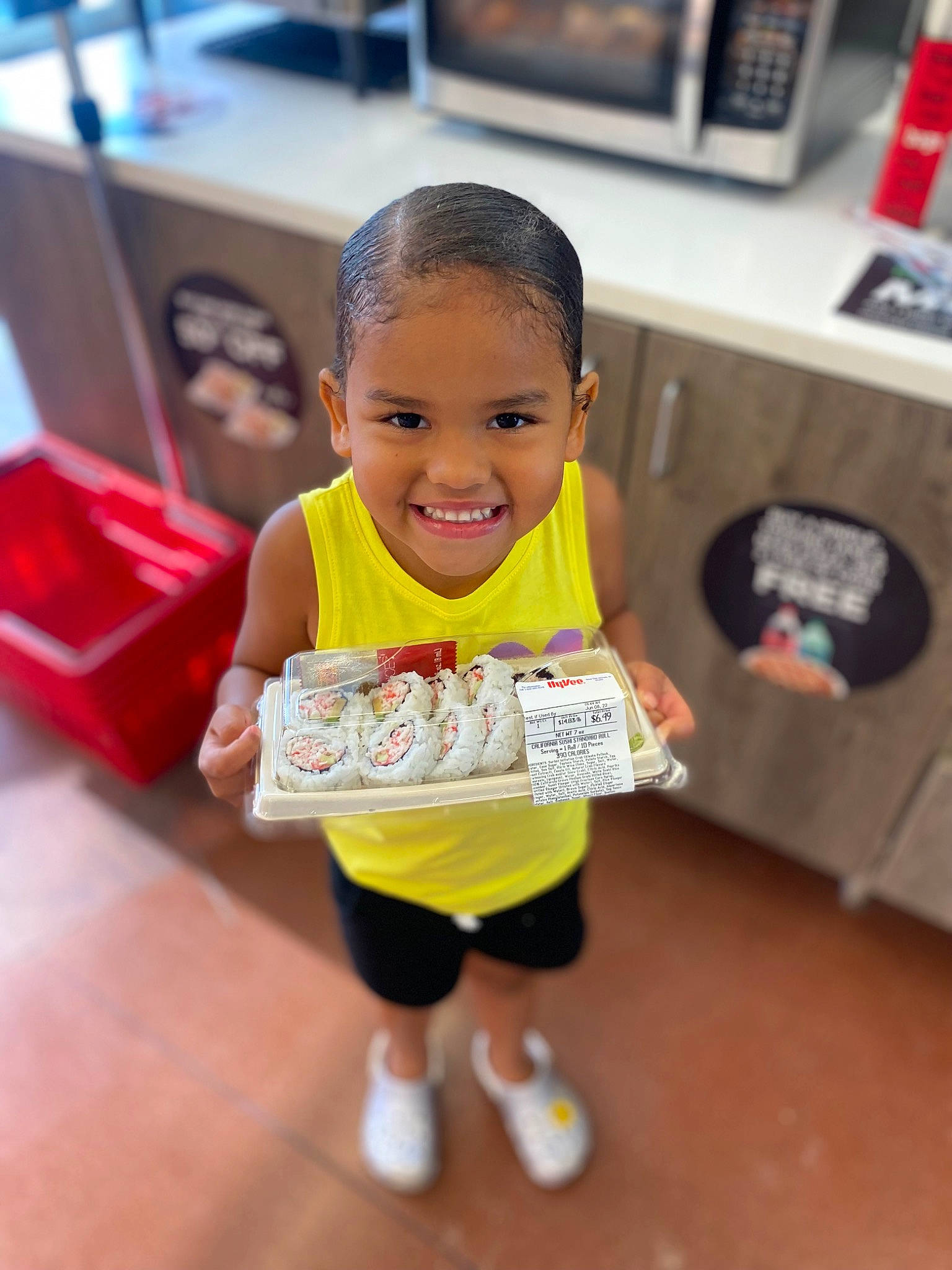 Amaya is registered to the contest to win money with this photo: baby, baby_toddler_clothing, box, child, flooring, fun, happy, joy, kindergarten, leisure, party, person, play, recreation, room, shorts, skin, sleeve, smile, t_shirt