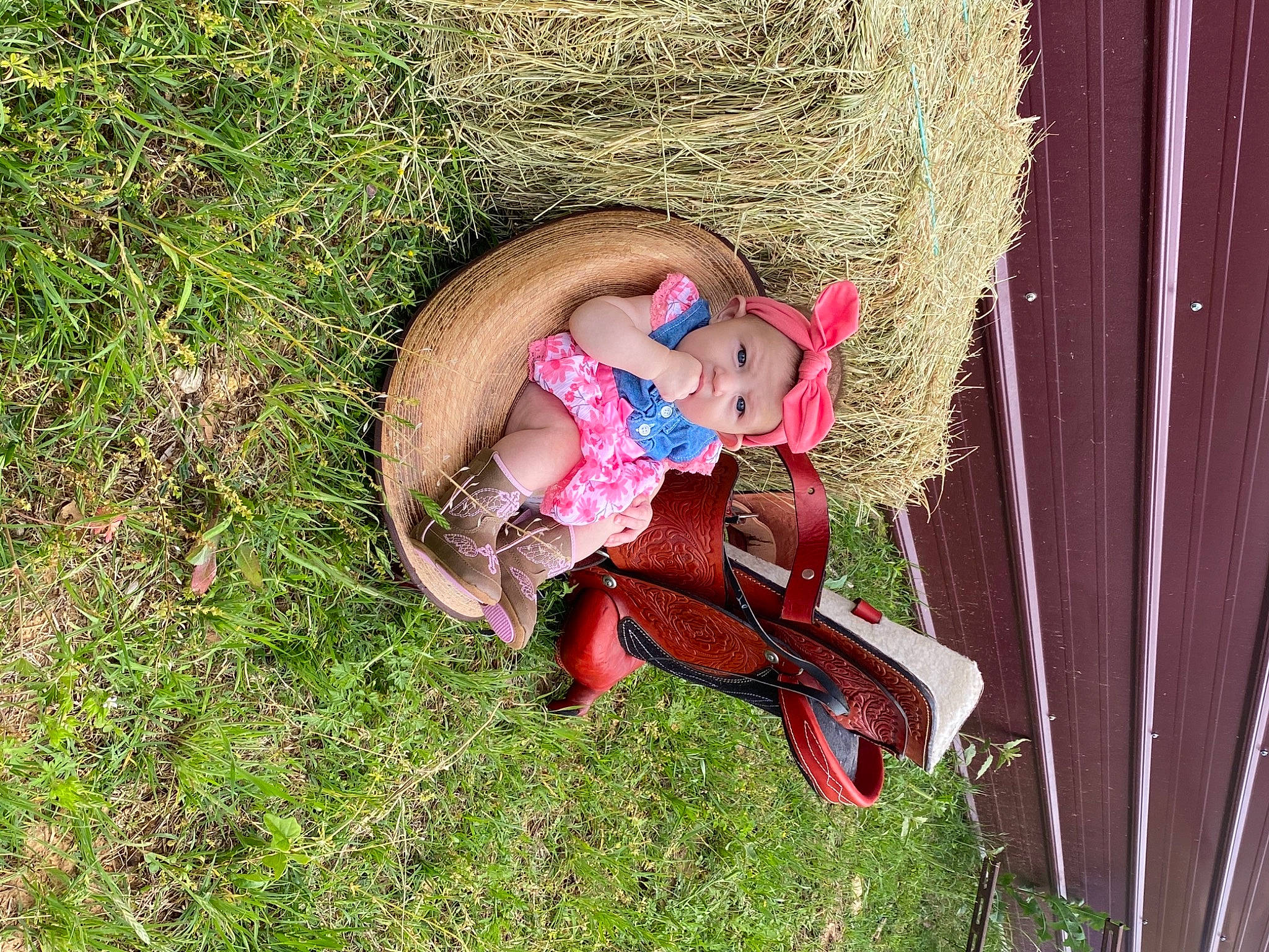 Rosalyn joined the competition — help win amazing prizes! child, doll, fawn, grass, hat, headgear, headwear, landscape, lawn_ornament, leg, leisure, magenta, people_in_nature, person, plant, sandal, sitting, soil, sunglasses, thigh
