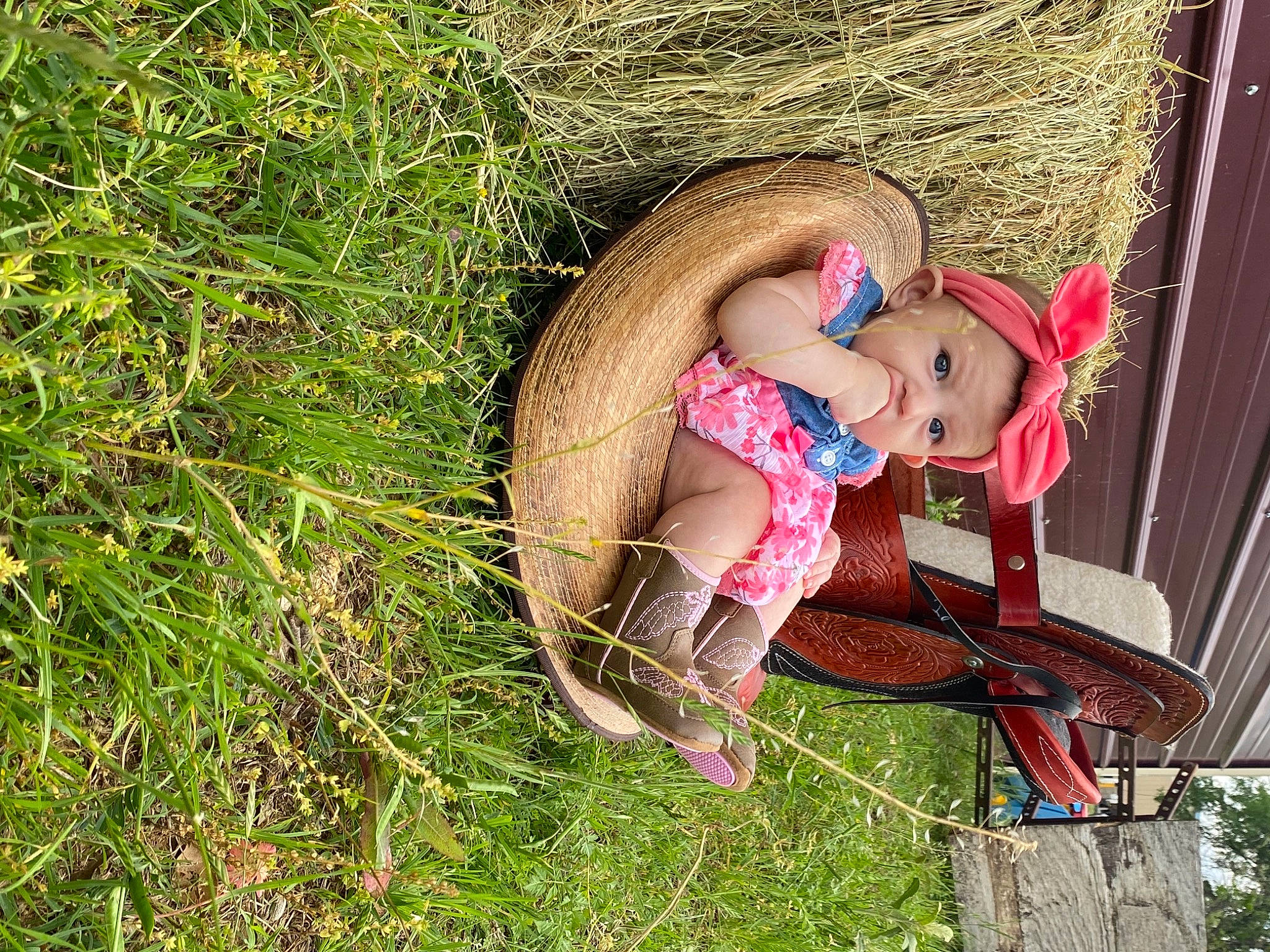Rosalyn joined the competition — help win amazing prizes! chair, child, doll, fawn, fun, grass, grass_family, hat, headwear, human_body, human_leg, leg, leisure, people_in_nature, person, plant, sandal, sitting, sun_hat, sunglasses