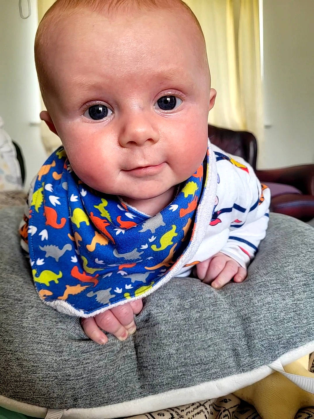 Finley is registered to the contest to win money with this photo: baby, baby_toddler_clothing, cheek, child, collar, comfort, crawling, electric_blue, finger, floor, flooring, happy, iris, mouth, nose, person, sitting, skin, sleeve, toddler
