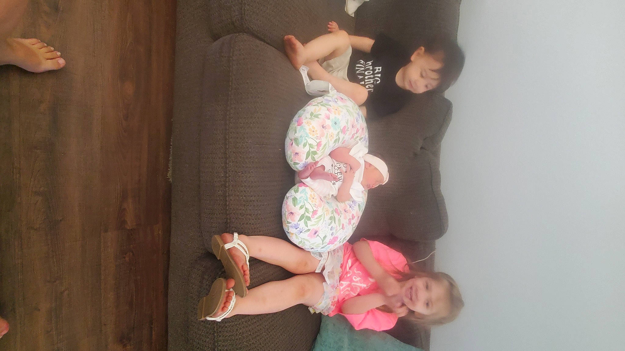 Annabelle is registered to the contest to win money with this photo: baby_toddler_clothing, comfort, elbow, foot, fun, gesture, happy, human_leg, joint, joy, knee, leisure, person, pink, sitting, smile, thigh, thumb, toddler, trunk