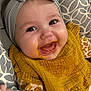 Arya participe au concours pour gagner de l'argent avec cette photo : baby, infant, smiling, headband, bow, bib, yellow, mustard, food, messy, happy, face, clothing, patterned, seat, child, cute, cheerful, closeup, indoor
