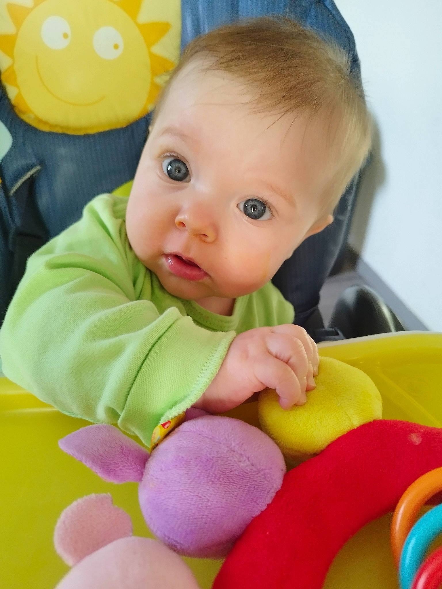 Nina participe au concours pour gagner de l'argent avec cette photo : baby, baby_playing_with_toys, baby_products, baby_toddler_clothing, baby_toys, cheek, child, comfort, eye, facial_expression, fun, happy, human_body, person, product, sitting, skin, sock, toddler, tummy_time