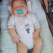 Bradley participe au concours pour gagner de l'argent avec cette photo : baby, sleeping, pacifier, onesie, infant, child, polka_dot, cushion, stroller, peaceful, cute, small_hands, legs, resting, indoors, soft_lighting, white_clothing, blue_pacifier, newborn, portrait