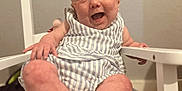 Adalynn is registered to the contest to win money with this photo: baby, child, smiling, happy, striped_clothing, white_chair, indoor, furniture, seat, person, cute, infant, portrait, skin, legs, hand, head, eyes, mouth, baby_clothes