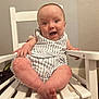 baby, child, smiling, happy, striped_clothing, white_chair, indoor, furniture, seat, person, cute, infant, portrait, skin, legs, hand, head, eyes, mouth, baby_clothes