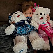 Destiny joined the competition — help win amazing prizes! toddler, child, plush_toy, teddy_bear, pacifier, couch, blanket, indoor, cute, soft_toys, child_playing, fancy_dress, pink, blue, person, face, sitting, cozy, home, young_child