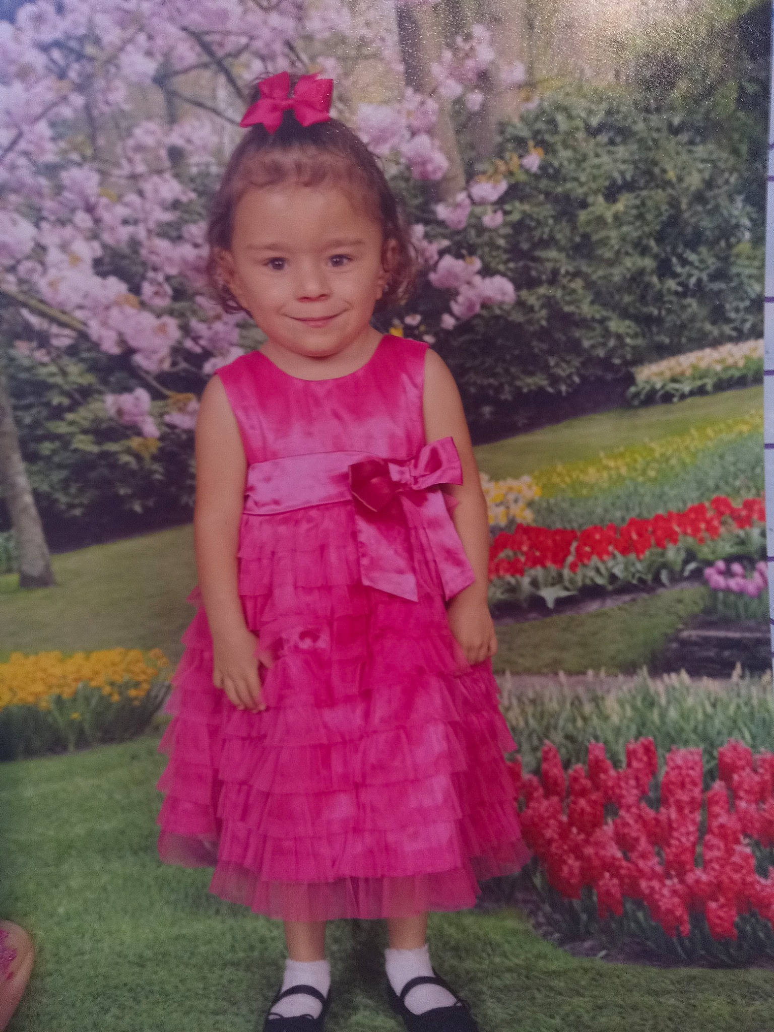 Mae joined the competition — help win amazing prizes! baby_toddler_clothing, child, day_dress, flower, formal_wear, grass, happy, joy, magenta, nature, pattern, people_in_nature, person, petal, pink, plant, purple, sleeve, smile, textile