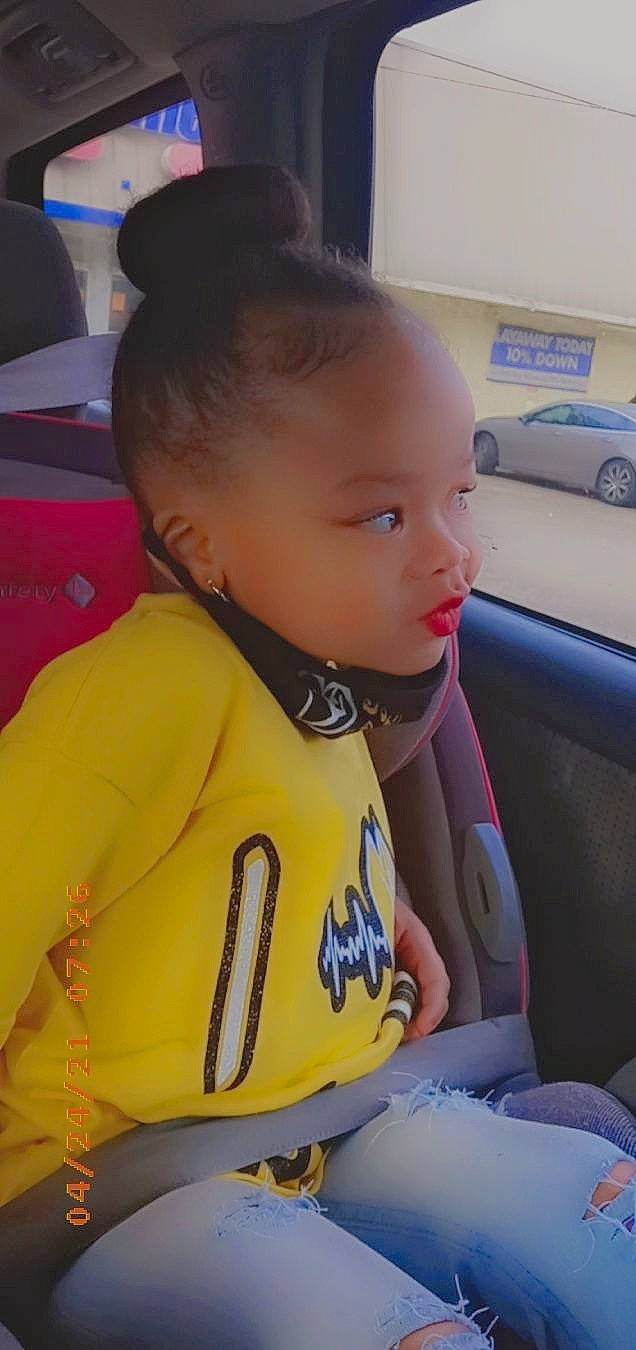 Tianna is registered to the contest to win money with this photo: baby, car, car_seat, cheek, child, eye, eyebrow, fun, happy, head_restraint, human_body, mammal, motor_vehicle, nose, person, seat_belt, skin, steering_wheel, toddler, vehicle_door