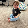 baby, toddler, child, sitting, carpet, beanbag_chair, office_chair, desk, indoor, playroom, onesie, long_sleeves, barefoot, rosy_cheeks, serious_expression, gazing_at_camera, short_hair, light_skin, hands, feet