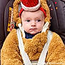 baby, child, car_seat, costume, fuzzy, bear, hat, santa_hat, pom_pom, blue_eyes, straps, seatbelt, cute, holiday, festive, indoor, soft_texture, infant, wearing, portrait