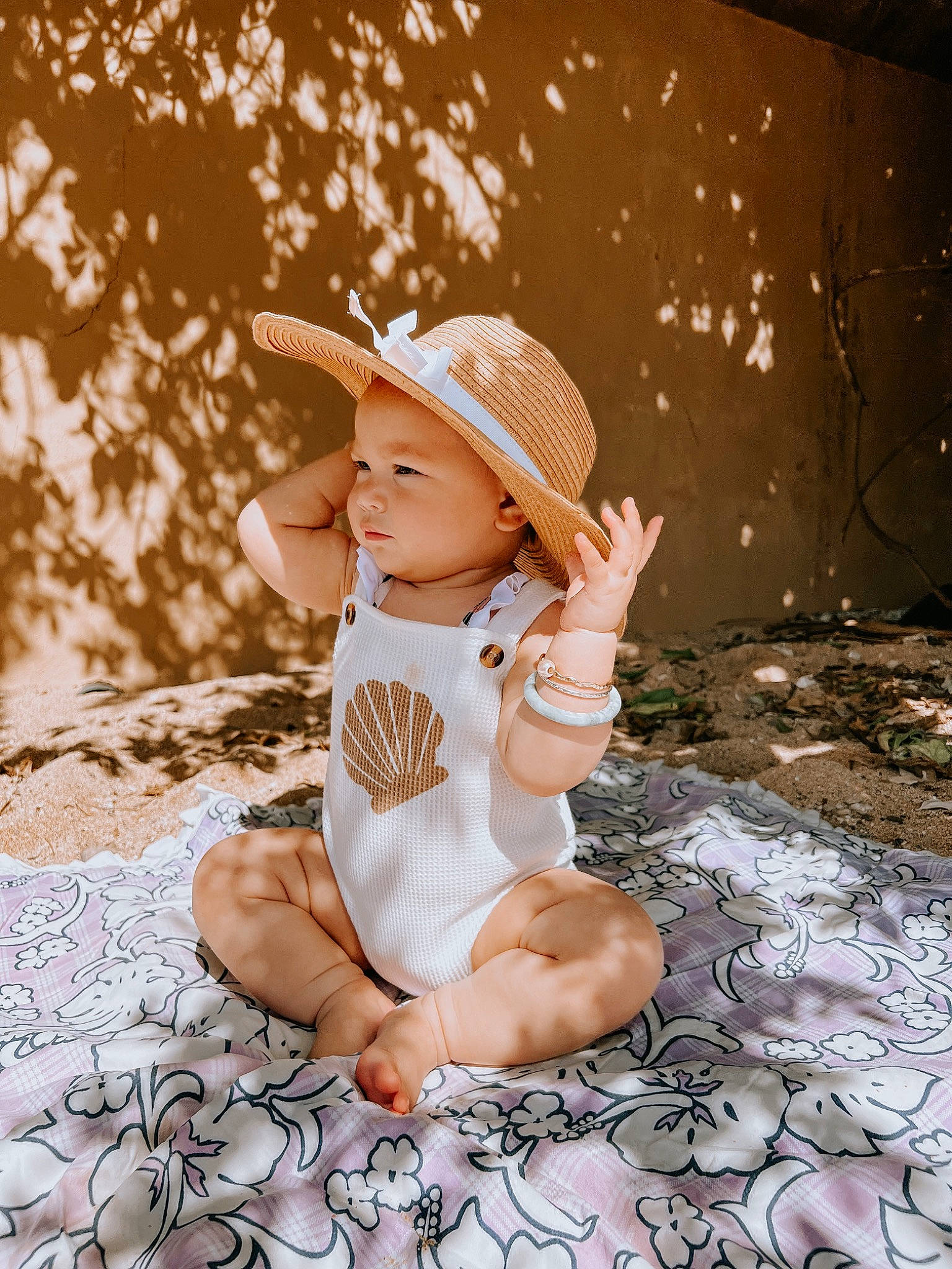 Ellie is registered to the contest to win money with this photo: baby, baby_toddler_clothing, child, dress, fashion_accessory, fedora, flash_photography, foot, fun, grass, happy, hat, headgear, headwear, pattern, people_in_nature, person, sitting, smile, stock_photography