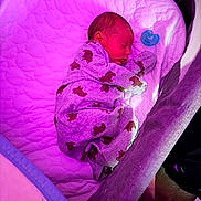 Augustine joined the competition — help win amazing prizes! newborn, baby, sleeping, infant, bassinet, crib, pacifier, pajamas, blanket, portrait, indoor, bedtime, resting, curled_up, cozy, purple_lighting, nursery, child, face, photography
