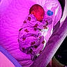 newborn, baby, sleeping, infant, bassinet, crib, pacifier, pajamas, blanket, portrait, indoor, bedtime, resting, curled_up, cozy, purple_lighting, nursery, child, face, photography