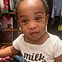 Elijah joined the competition — help win amazing prizes! toddler, child, baby, onesie, clothing, face, expression, hand, nails, closet, clothes, shelf, indoors, person, portrait, casual, cute, funny_face, holding, home