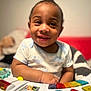 Elijah joined the competition — help win amazing prizes! baby, child, smile, toy, keyboard, colorful, happy, infant, cute, playing, clothing, indoors, blanket, face, person, small_child, joy, hands, seated, early_childhood