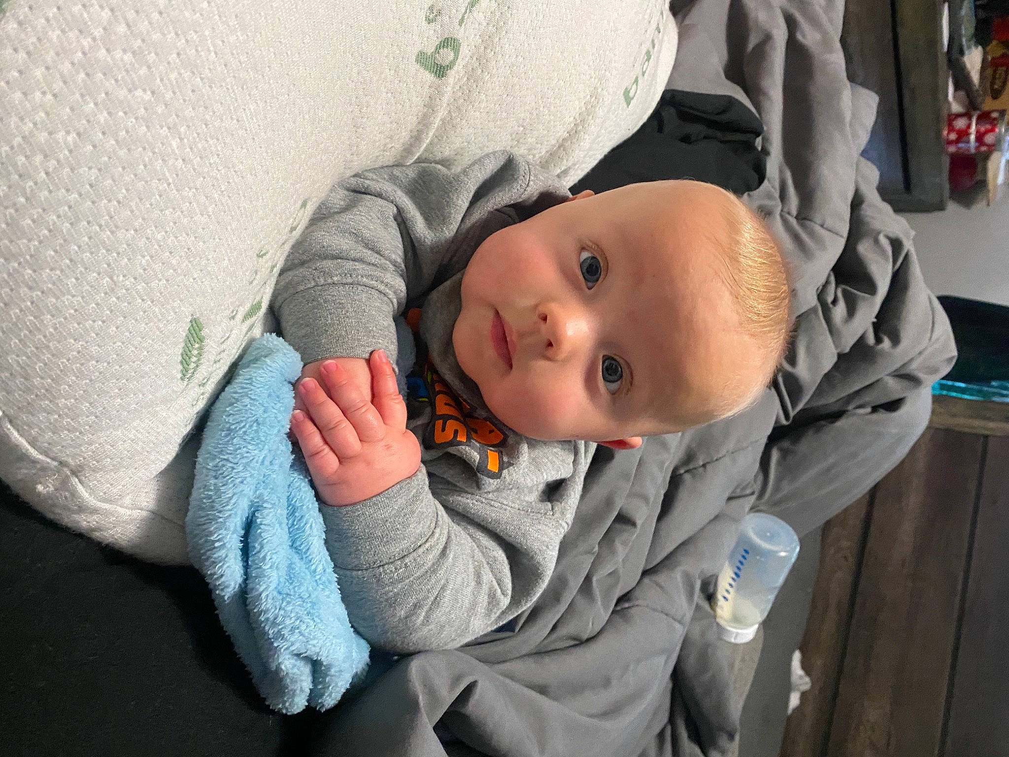 Dominique joined the competition — help win amazing prizes! baby, baby_carriage, baby_products, baby_toddler_clothing, cheek, child, comfort, face, grey, linens, mouth, nose, outerwear, person, sitting, skin, sleeve, textile, toddler, tree