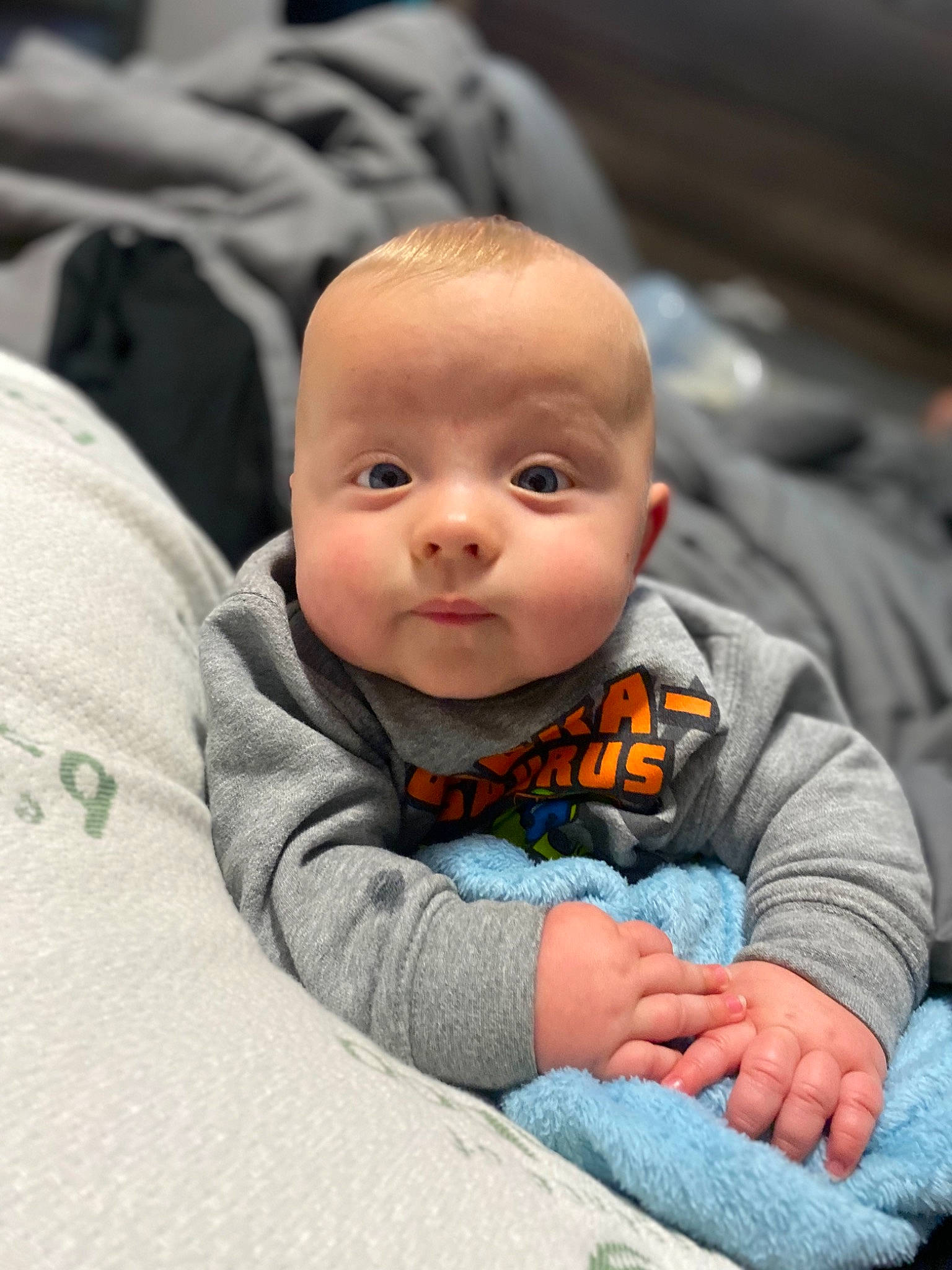 Dominique joined the competition — help win amazing prizes! baby, baby_products, baby_toddler_clothing, cheek, close_up, comfort, eye, fun, grass, grey, happy, iris, linens, mouth, nose, person, sitting, skin, sleeve, toddler