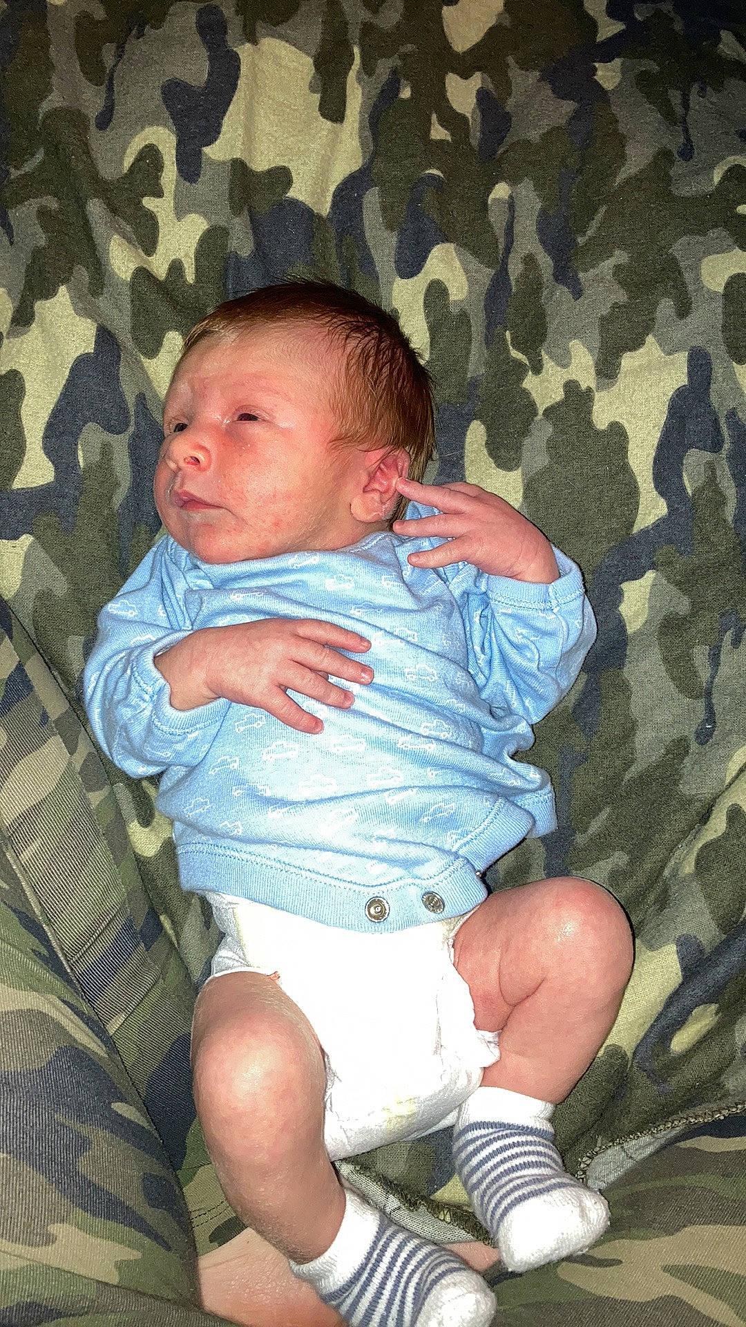 Anneak is registered to the contest to win money with this photo: baby, baby_toddler_clothing, cheek, child, comfort, finger, foot, human_leg, iris, knee, lap, leg, person, sitting, skin, sleeve, sock, thigh, thumb, toddler