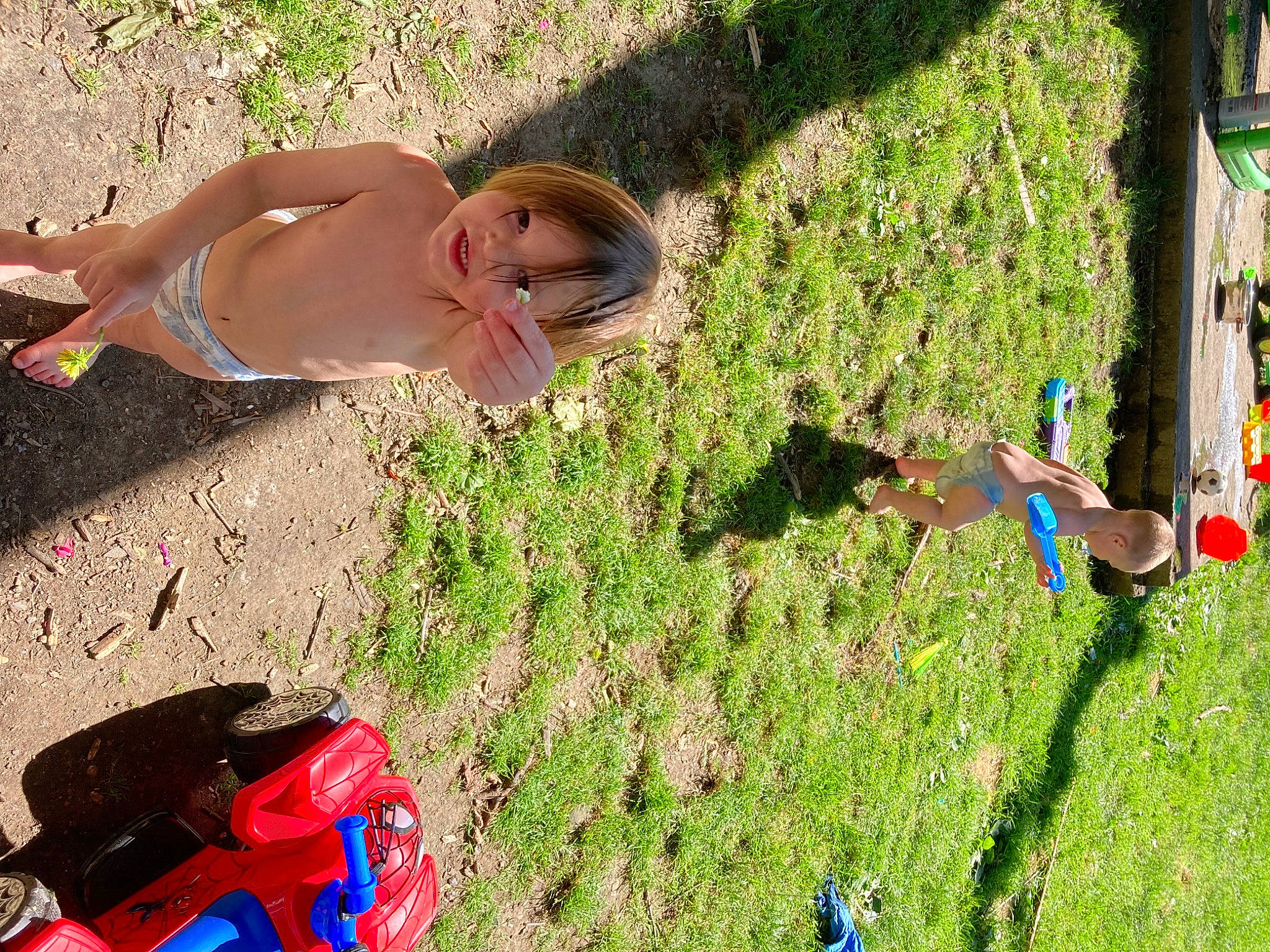 Cruze Cook joined the competition — help win amazing prizes! blue, child, fun, grass, green, human_leg, landscape, leisure, people_in_nature, person, personal_protective_equipment, plant, recreation, shrub, soil, summer, swimwear, thigh, toddler, toy_vehicle