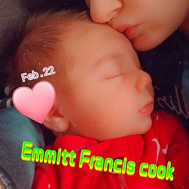 Emmitt Cook is registered to the contest to win money with this photo: cheek, chin, ear, eyelash, facial_expression, finger, forehead, gesture, hand, happy, head, human_body, interaction, lip, mouth, nose, organ, people_in_nature, person, pink