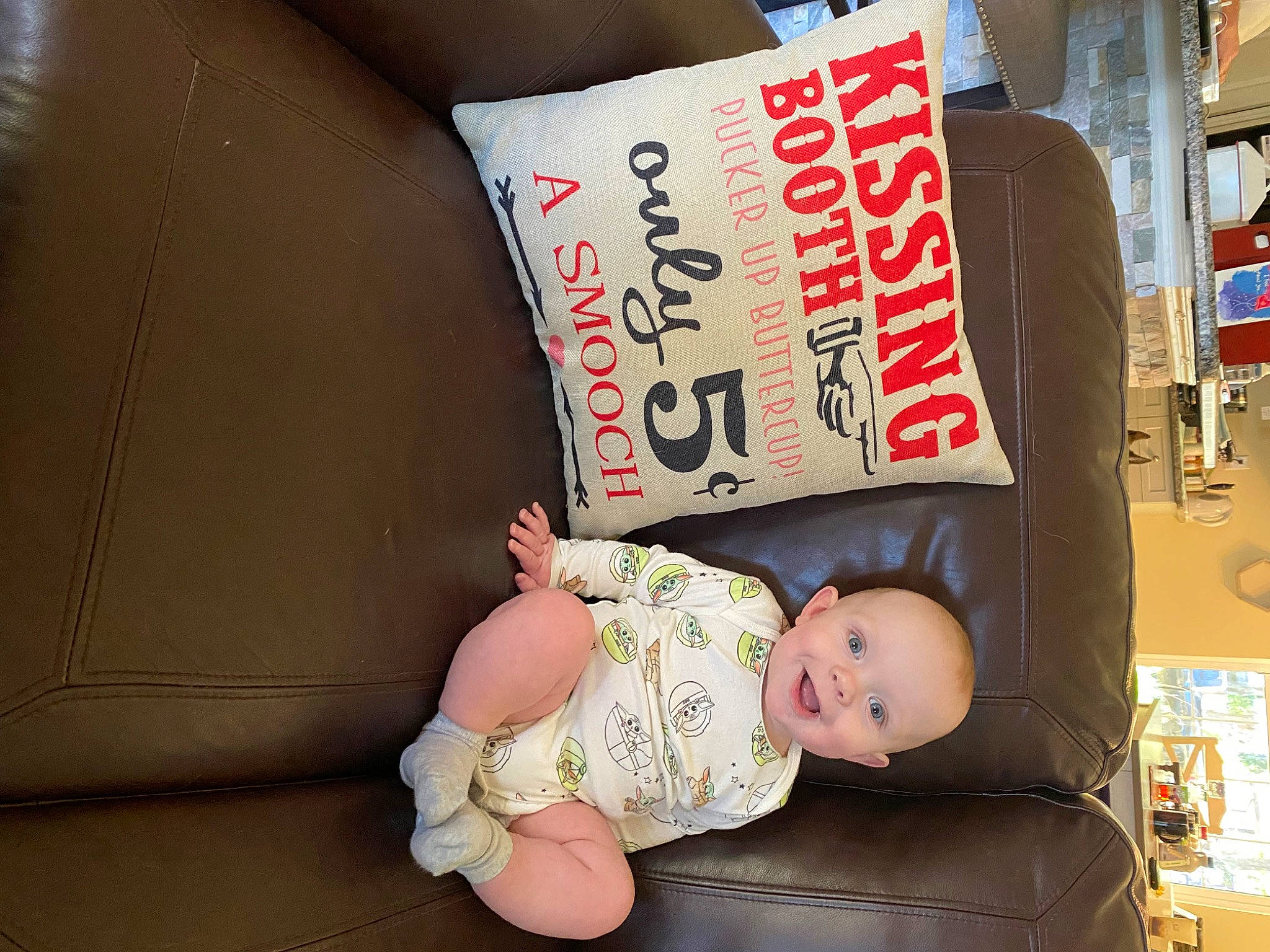 Orion is registered to the contest to win money with this photo: baby, baby_products, baby_toddler_clothing, child, comfort, font, happy, joy, person, room, sitting, toddler, white