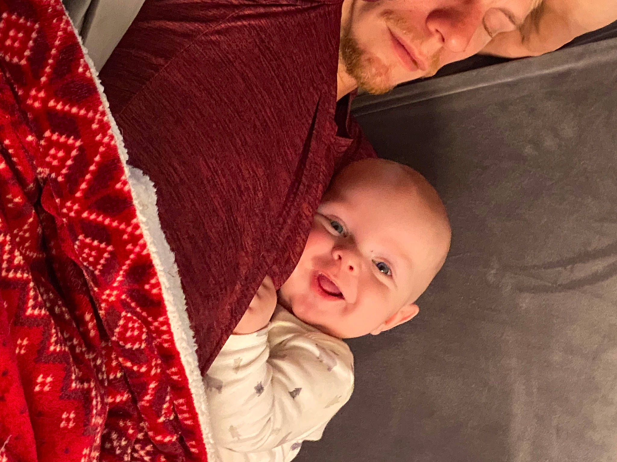 Orion is registered to the contest to win money with this photo: baby, comfort, couch, eye, face, facial_expression, fun, happy, head, human, interaction, lap, nose, organ, outerwear, people, person, skin, smile, toddler
