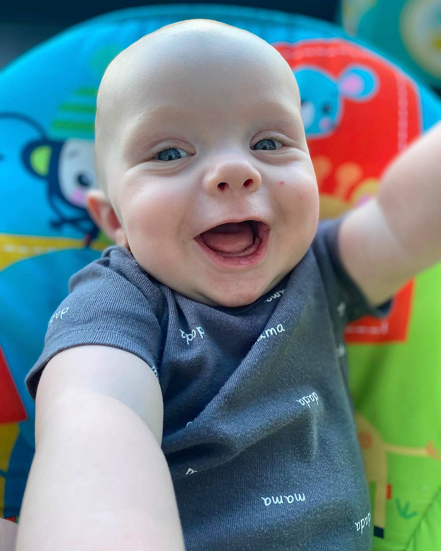 Orion is registered to the contest to win money with this photo: baby, baby_laughing, baby_playing_with_toys, baby_toddler_clothing, blue, cheek, child, eye, fun, gesture, happy, head, iris, leisure, mouth, nose, person, product, skin, smile