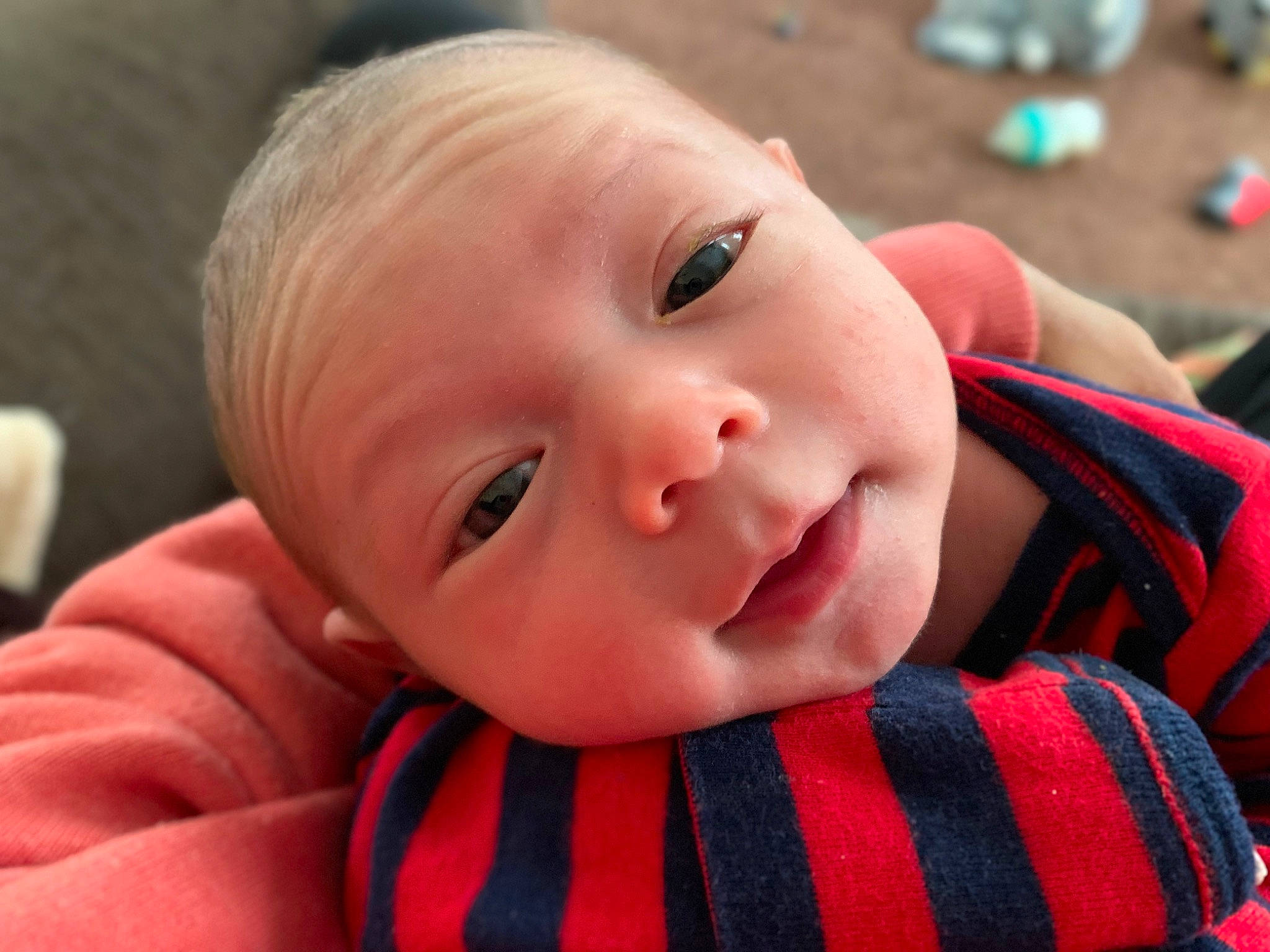 Finnley joined the competition — help win amazing prizes! baby, baby_toddler_clothing, cheek, child, chin, facial_expression, finger, fun, happy, iris, lip, mouth, nose, person, pink, skin, smile, tartan, textile, thumb