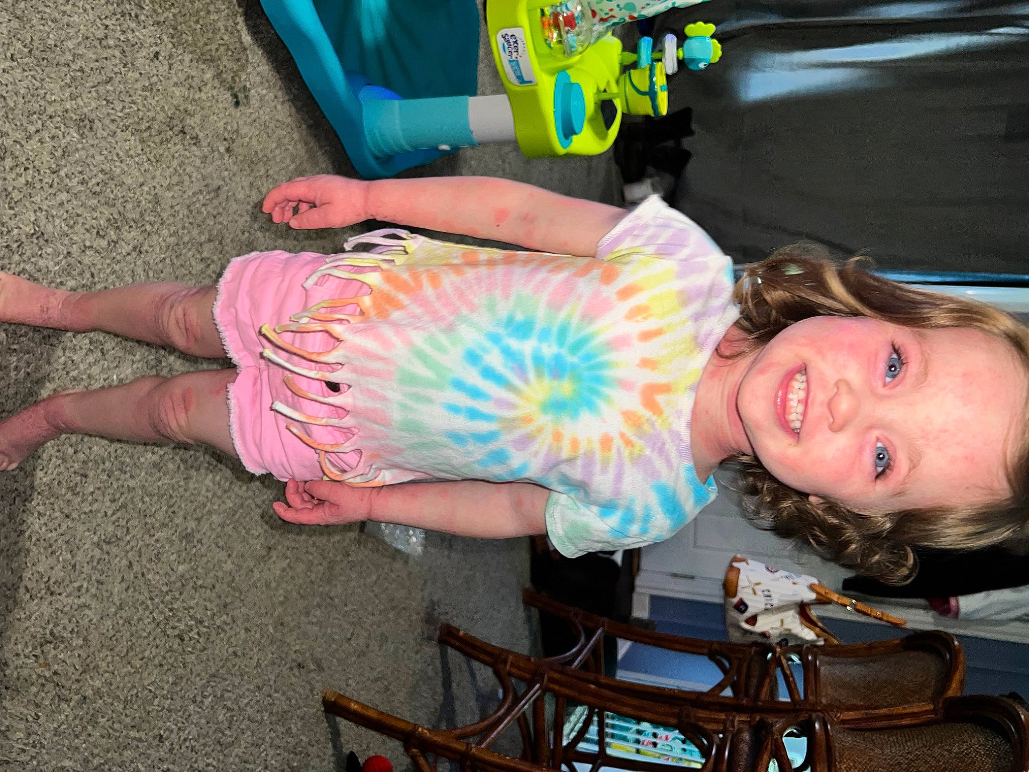 Ava is registered to the contest to win money with this photo: blue, chair, child, electric_blue, event, fun, happy, human_leg, joy, leisure, person, pink, recreation, sandal, shorts, sitting, smile, summer, t_shirt, thigh