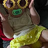 Nova joined the competition — help win amazing prizes! baby, child, pacifier, sunglasses, flower_sunglasses, yellow_skirt, cream_top, sitting, hands, person, indoor, cute, accessories, playful, face, head, legs, lap, fashion, portrait