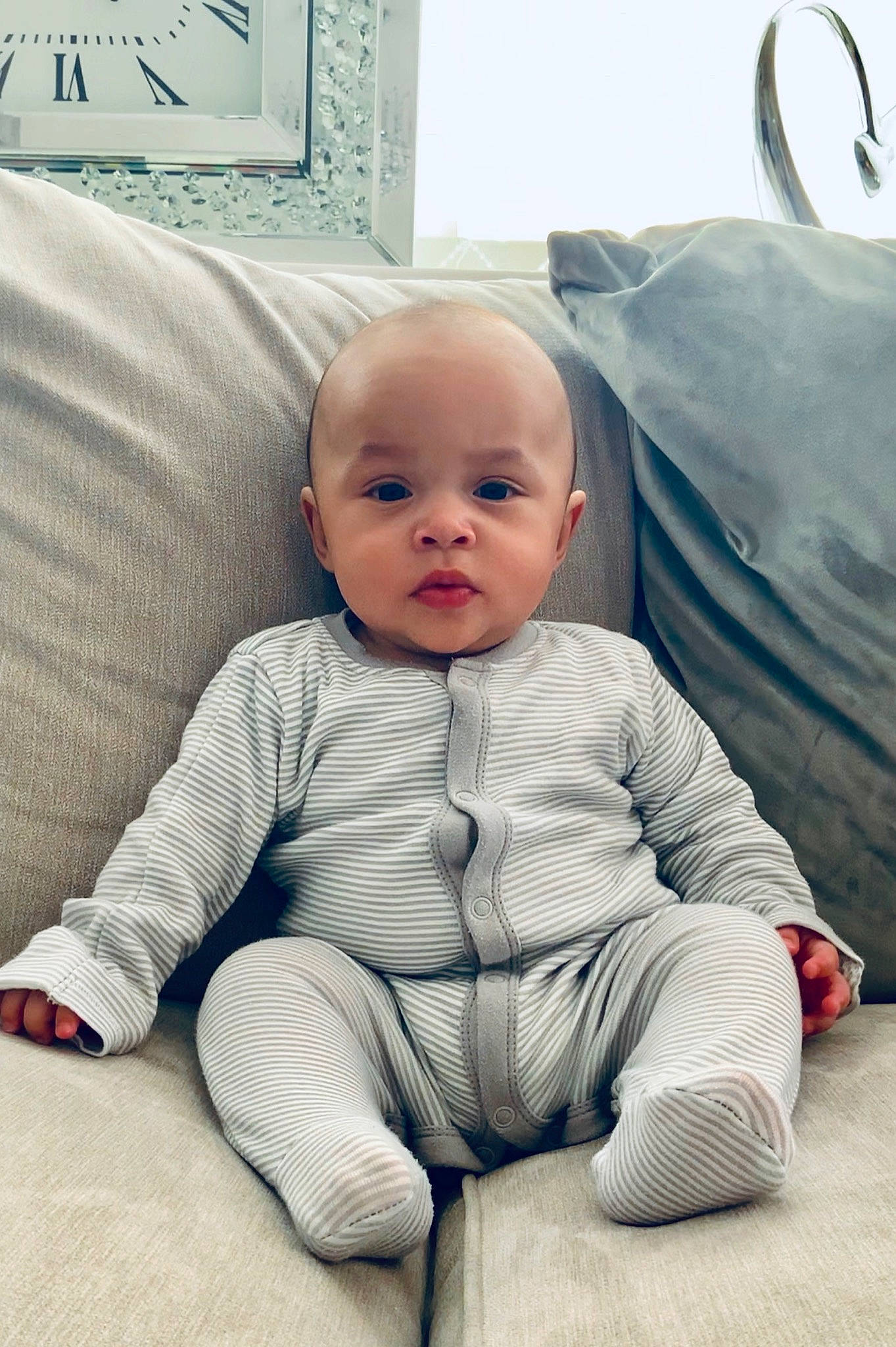 Jadyn is registered to the contest to win money with this photo: baby, cheek, child, comfort, face, head, nose, pattern, person, product, room, sitting, skin, sleeve, toddler