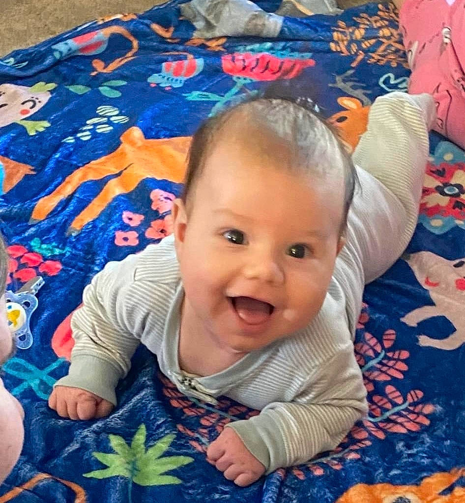 Leven is registered to the contest to win money with this photo: baby, baby_toddler_clothing, blue, cheek, cloud, cool, eye, facial_expression, happy, head, human, iris, mouth, nose, person, photograph, product, skin, smile, textile