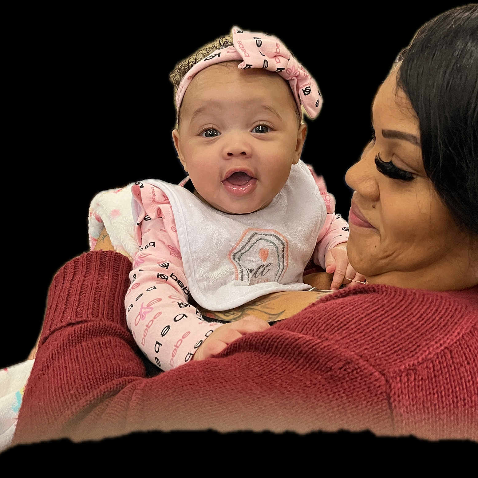 Kalayiah joined the competition — help win amazing prizes! baby, bib, blanket, child, close_up, cozy_sweater, cuddling, eyelashes, hands, happy, headband, holding, indoor, infant, mother, portrait, smiling, sweater, tattoo, woman