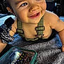 Rafaël participe au concours pour gagner de l'argent avec cette photo : baby, smiling, crawling, overalls, bandana, toolbox, indoor, closeup, face, eyes, skin, child, happy, expression, hand, blanket, toy, curious, person, floor