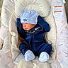 Izaiah joined the competition — help win amazing prizes! newborn, baby, infant, sleeping, portrait, car_seat, onesie, tracksuit, beanie, hat, booties, navy_blue, white, gold_chain, nike, cushion, blanket, patterned_fabric, indoor, peaceful
