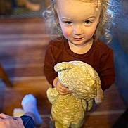 Gunner is registered to the contest to win money with this photo: blonde, blue_eyes, candid, casual_clothing, child, cozy, curly_hair, hand, hardwood_floor, home_interior, innocence, living_room, looking_up, plush_toy, portrait, smile, sock, stuffed_animal, toddler, toy